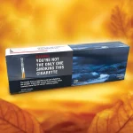 Carton of Canadian Classics Original cigarettes on an orange background with tobacco leaves